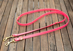 Bright pink and brass dog leash in biothane. Waterproof walk two dogs at once
