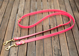 Bright pink and brass dog leash in biothane. Waterproof walk two dogs at once