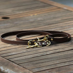 Biothane multi leash with brass hardware, displayed on table. Australian made dog leash